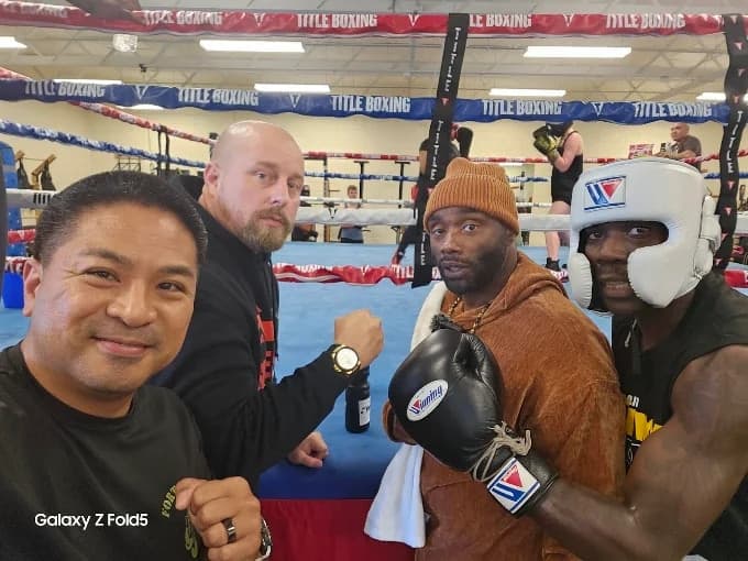 Mad House coaches and boxers training ringside