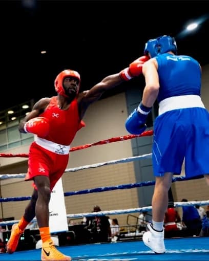Mad House boxer landing a punch during amateur competition