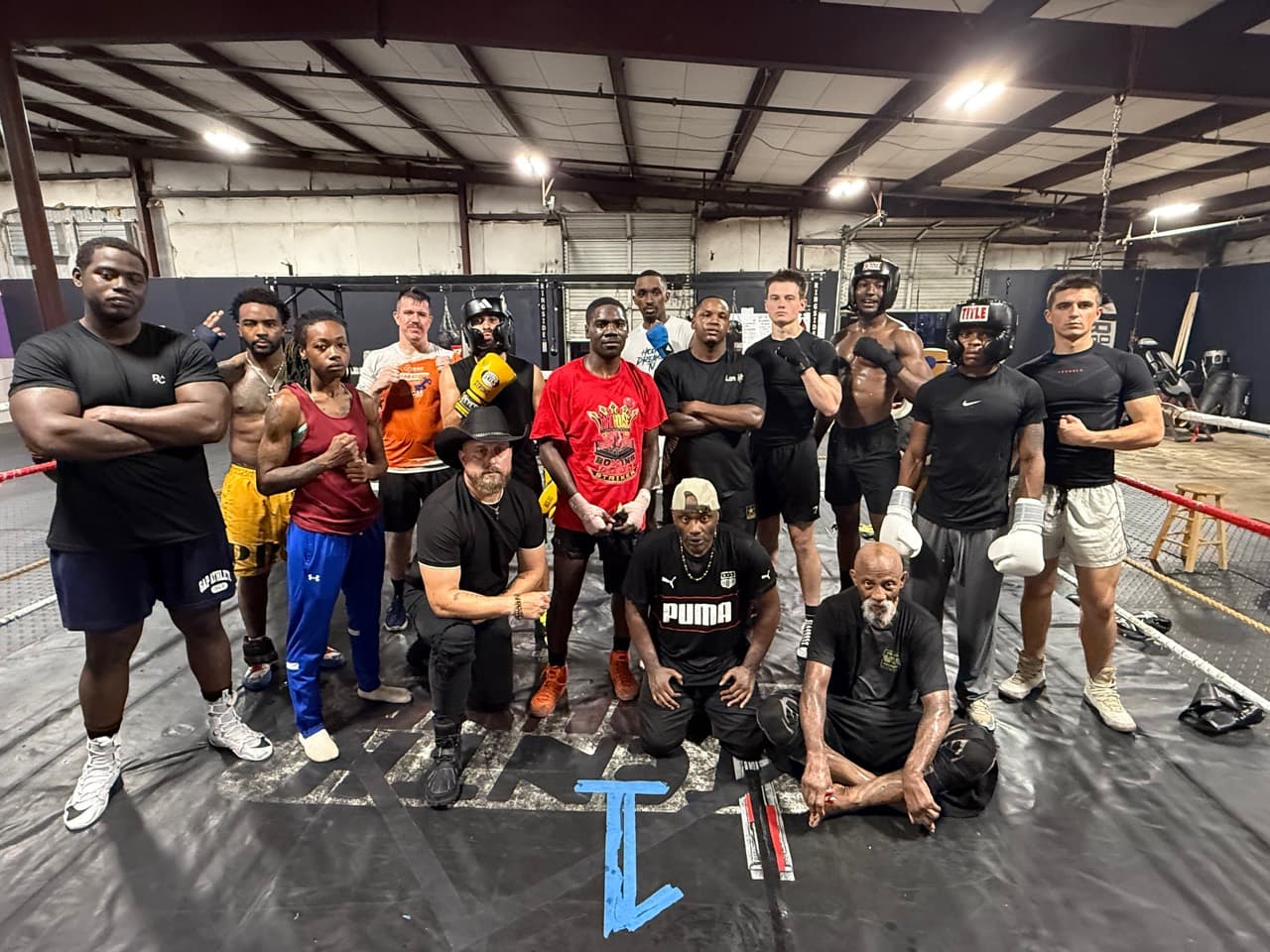 Mad House Boxing athletes and coaches together inside the ring